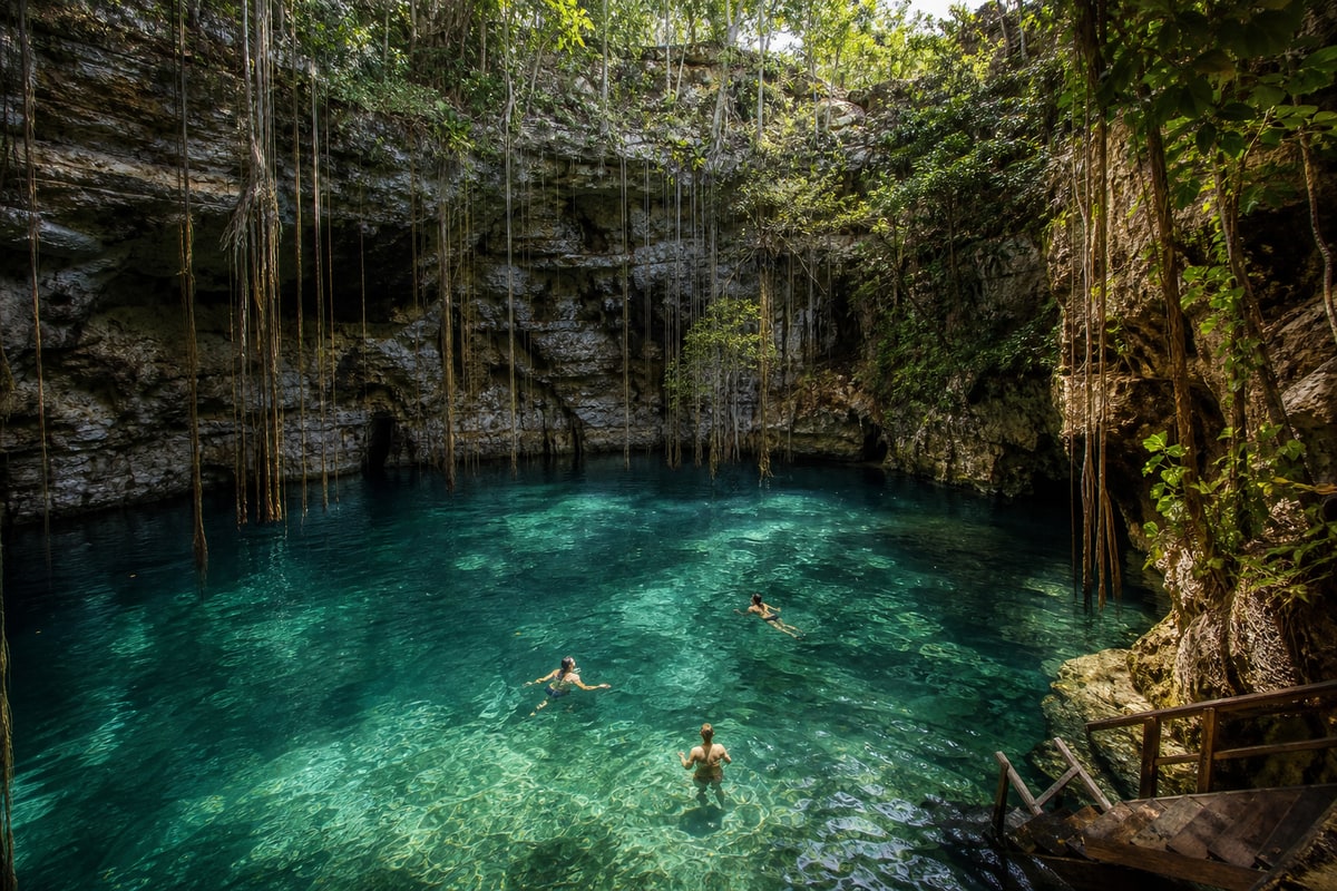 Travellers swimming in a representative Yucatán cenote during a day trip